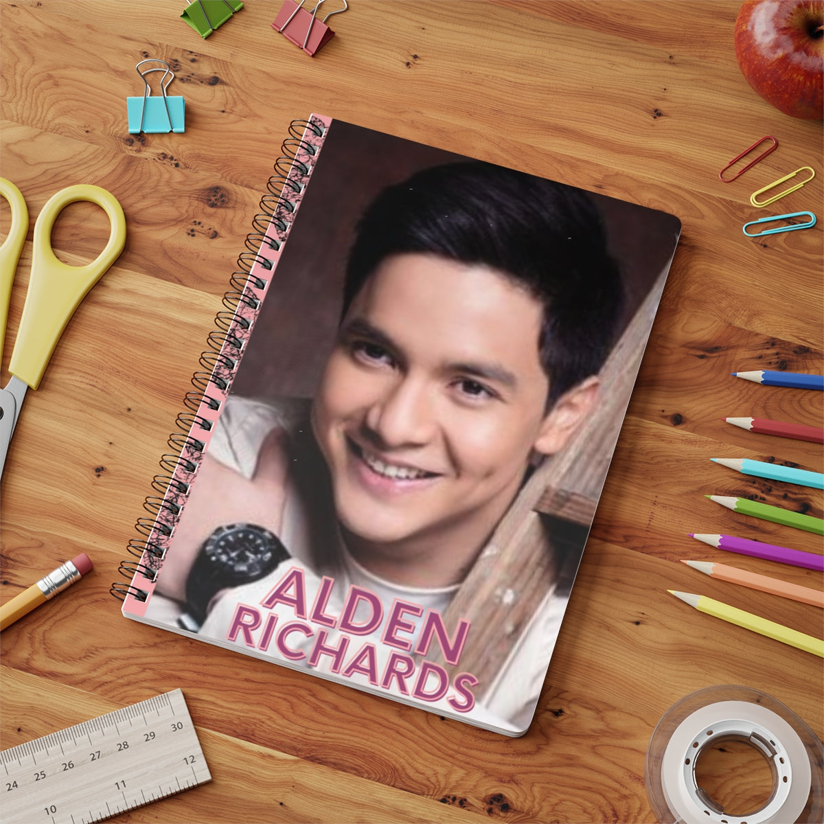 Alden Richards spiral bound notebook on a wooden desk with school supplies, perfect for Filipino teens and stationery lovers.