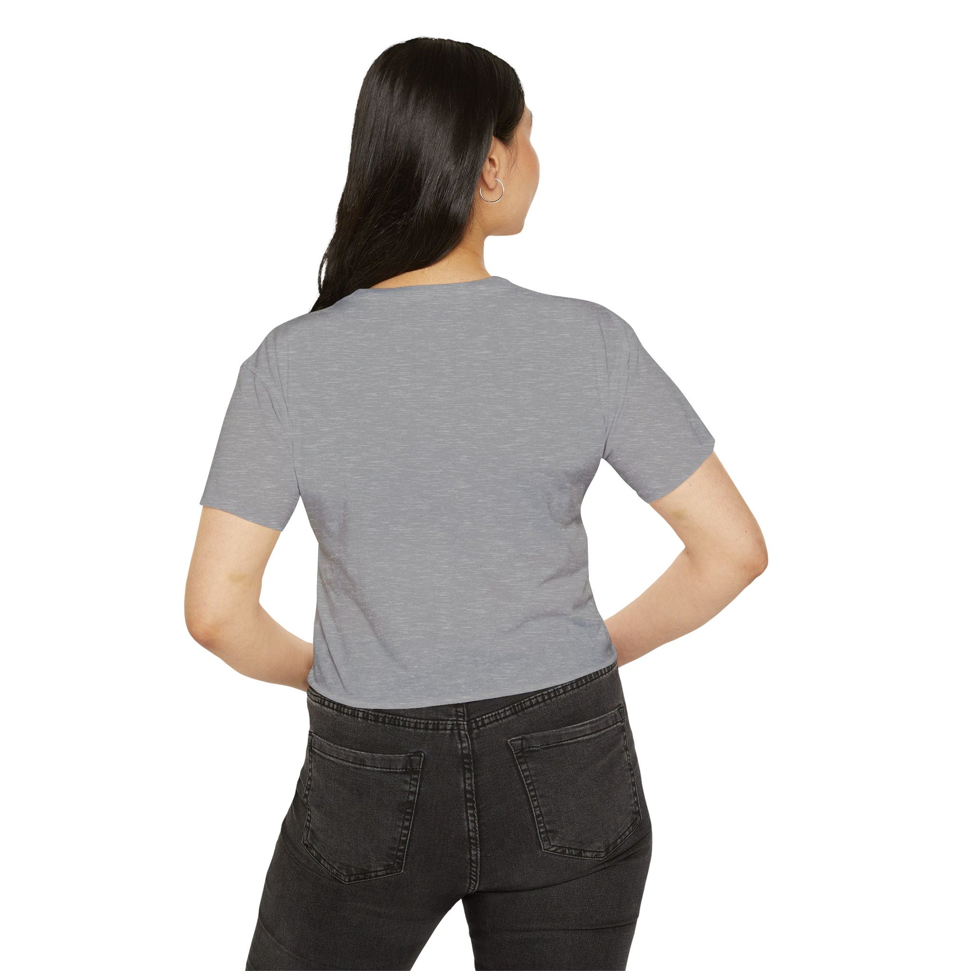 Back view of a woman wearing a gray crop top, ideal for concerts and festivals, showcasing casual style.